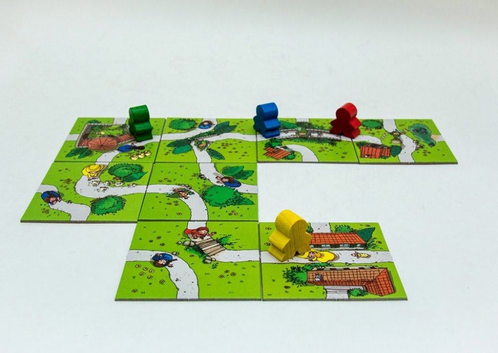 Настільна гра Діти Каркассону карта і фішки для гри зображення